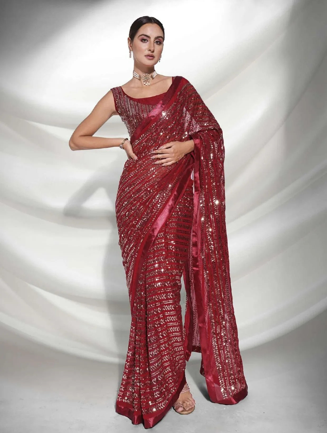 Women Party Wear Designer Sequence Worked Maroon Colour Georgette Saree Collection